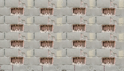 old gray industrial wall texture with damaged bricks