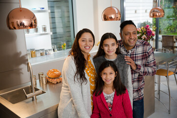 Portrait happy family in kitchen