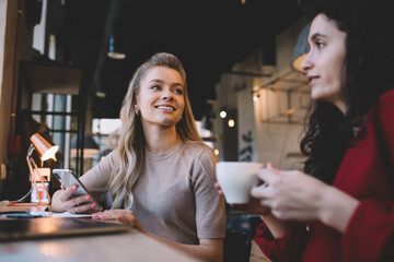 Female friends spending time together in cafe