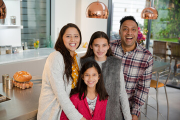 Portrait happy family in kitchen