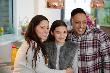 Portrait happy family in kitchen