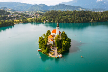Beautiful mountain lake Bled with turquoise blue water with small Pilgrimage Church on the island...