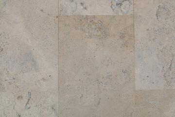 Dolomite natural stone texture. Stone with beige pattern on a smooth surface. Finishing building material.
