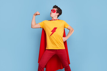Brave superhero man showing biceps
