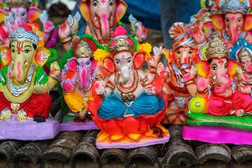 different types of lord ganesh idols arranged beautifully for celebration of ganesh chaturthi in india from different angle view