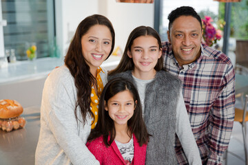 Portrait happy family in kitchen