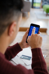 Close up man logging on to smart phone with face recognition