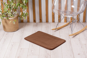Brown bath or toilet mat in interior. Soft rug for the living room