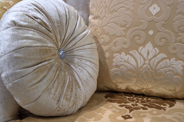 An image of a pillow lying on the couch.