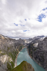 Obraz premium Amazing hiking day in the heart of the alps in Switzerland. Beautiful weather conditions at the peak of the mountain. Epic scenery at the alpine lake called Limmerensee.