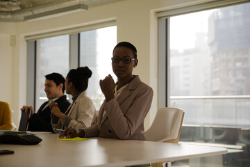 Smiling businesswoman in conference room meeting
