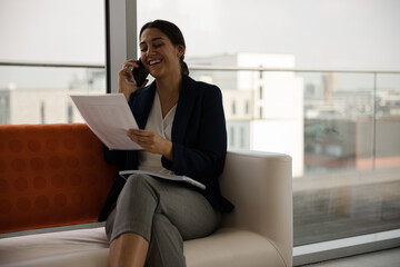 Portrait of businesswoman using smartphone in office