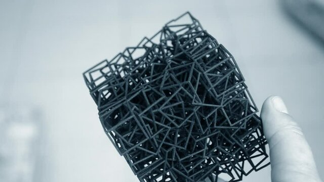 Man holding in his hand model that printed on 3D printe
