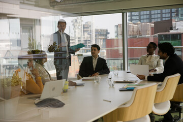 Fototapeta na wymiar Businessman leading conference room meeting