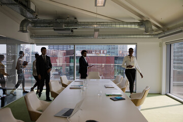 Business people gathering ion conference room