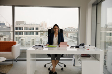 Portrait of smiling businesswoman in office