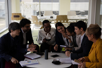 Business people discussing paperwork in relax zone