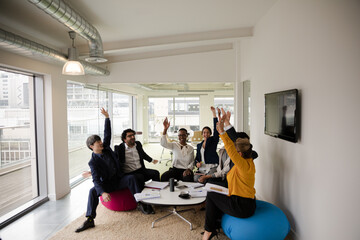 Fototapeta premium Business people discussing paperwork in relax zone