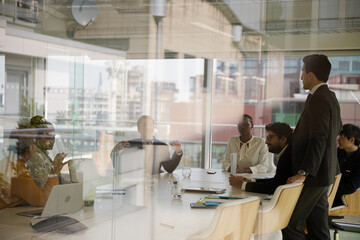 Businessman leading conference room meeting