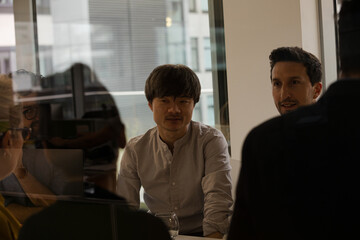 Business people eating sushi lunch in conference room