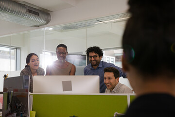 Business people brainstorming in open plan office