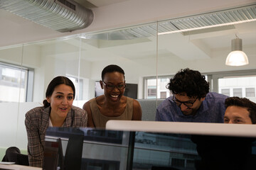 Business people brainstorming in open plan office