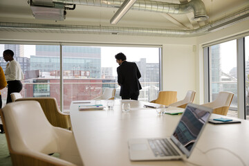 Business people leaving conference room after meeting