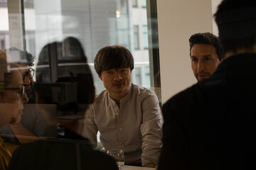 Business people eating sushi lunch in conference room