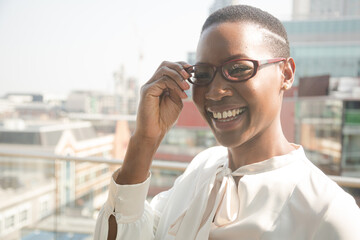 Portrait of businesswoman enjoying view from balcony