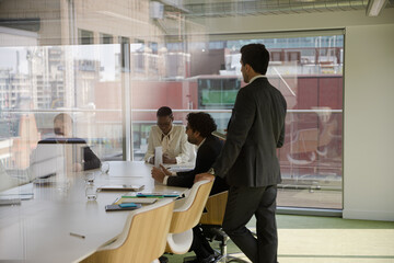 Businessman leading conference room meeting
