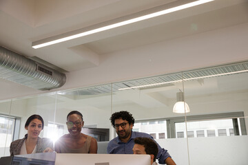 Business people brainstorming in open plan office