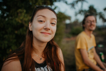 Portrait of a smiling brunette girl during sunset