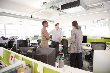 Fototapeta premium Business people talking in open plan office