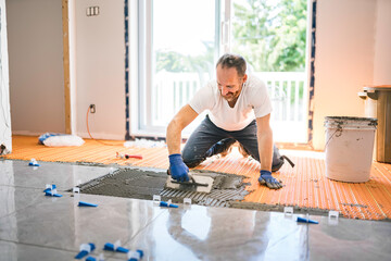 nice handyman install tile on the floor