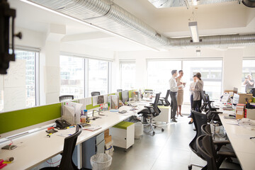 Fototapeta premium Business people talking in open plan office
