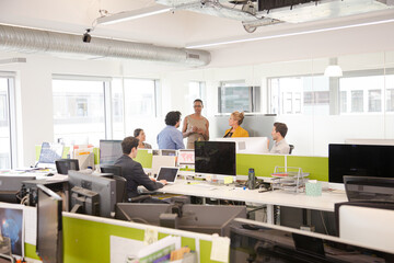 Business people meeting in open plan office