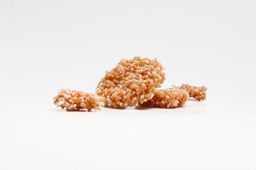 Indonesian traditional thick rice cracker called Rengginang or ranginang isolated on white background.