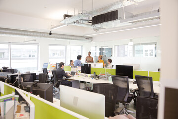 Business people meeting in open plan office