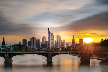 View of Frankfurt at sunset. Backlit shot with a view of the skyline. High-rise buildings of banks and insurance companies in the financial district
