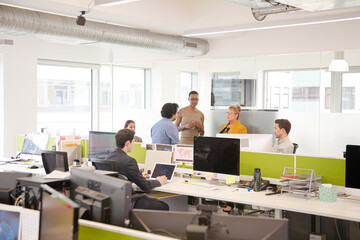 Business people meeting in open plan office