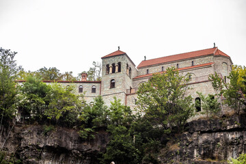 Fototapeta na wymiar View of Mghvimevi Georgian Orthodox monastery in region of Imereti, near the town of Chiatura, partly carved into rock