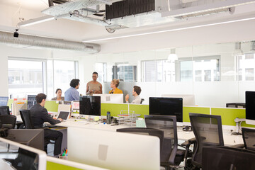 Business people meeting in open plan office