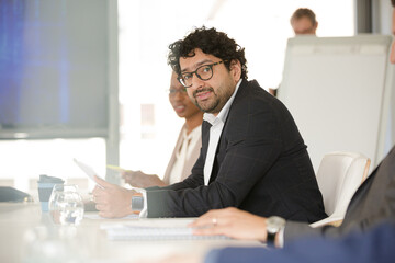 Portrait of businessman in conference room meeting