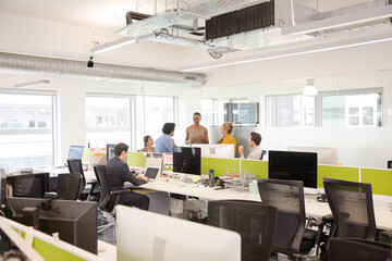 Business people meeting in open plan office