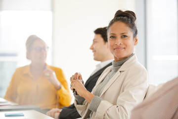 Obraz premium Portrait of smiling businesswoman in conference room meeting