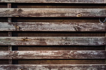Background from old boards. Horizontal wooden stripes. Old shabby wood planks. Wood strips.