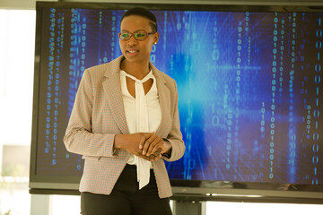 Businesswoman leading conference room meeting