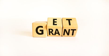 Get grant symbol. Turned wooden cubes with concept words 'Get grant' on a beautiful white background. Copy space. Business and get grant concept.