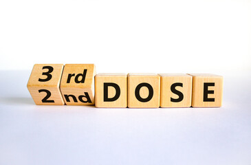 Covid-19 booster dose vaccine shot symbol. Turned cubes and changed words '2nd dose' to '3rd dose'. Beautiful white background, copy space. Covid-19 booster dose vaccine shot concept.