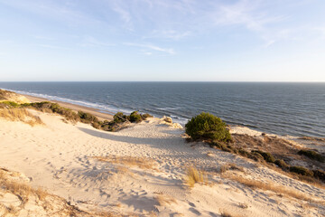 Spain's longest coastline is the coast of Huelva. From "Matalascanas" to "Ayamonte". Coast with cliffs, dunes, pine trees, green vegetation. It is considered one of the most beautiful beaches in Spain